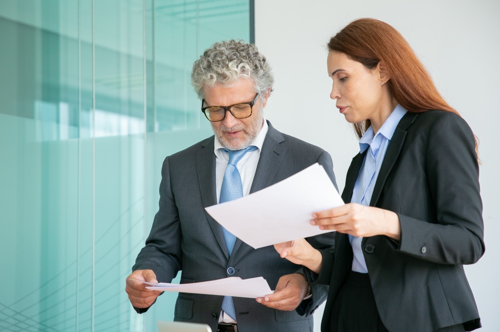 professional-partners-discussing-project-holding-papers-conference-room.jpg встреча